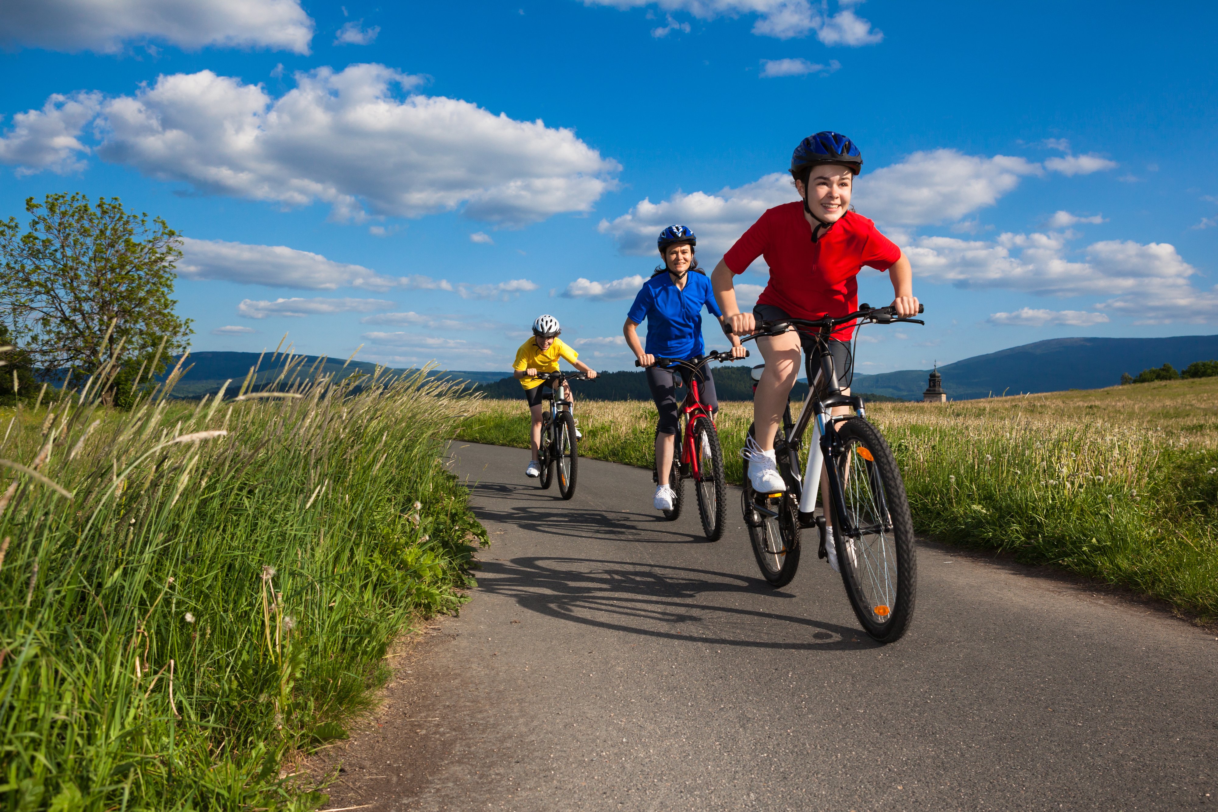 kids riding bikes, smiling